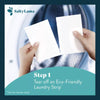 Hands tearing a SaltyLama laundry detergent sheet into two strips. The sheet is perforated. Each strip can clean up to a medium to large load of laundry.